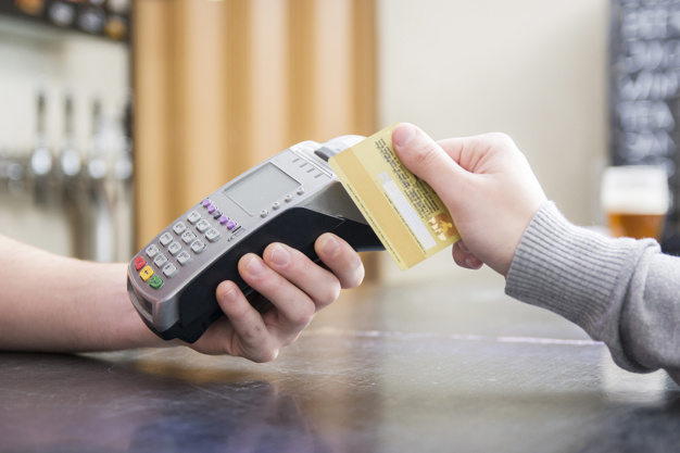 person paying with credit card